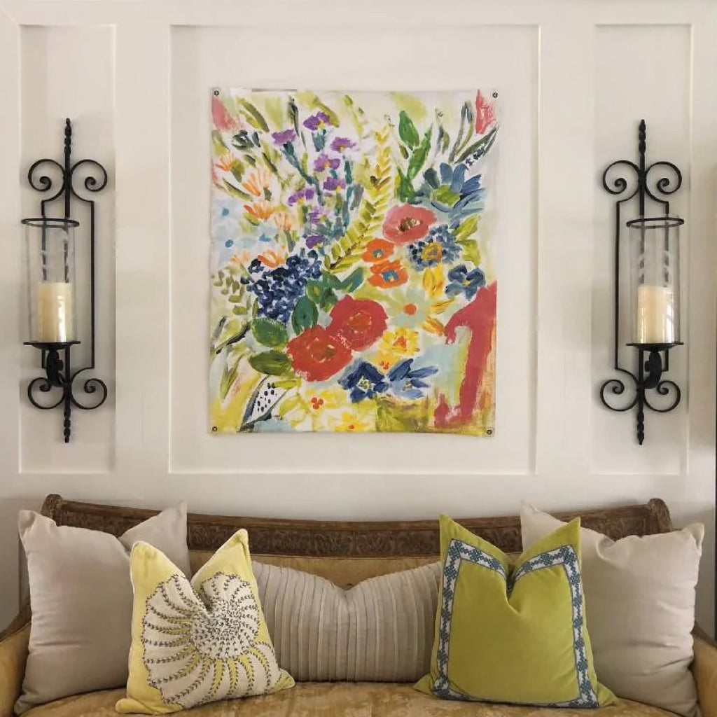 settee with decorative pillows and colorful artwork 