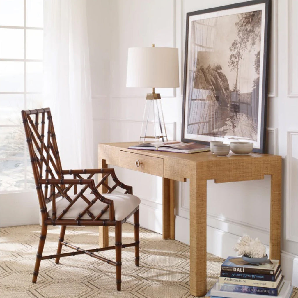 bamboo chair with woven desk and glass lamp 