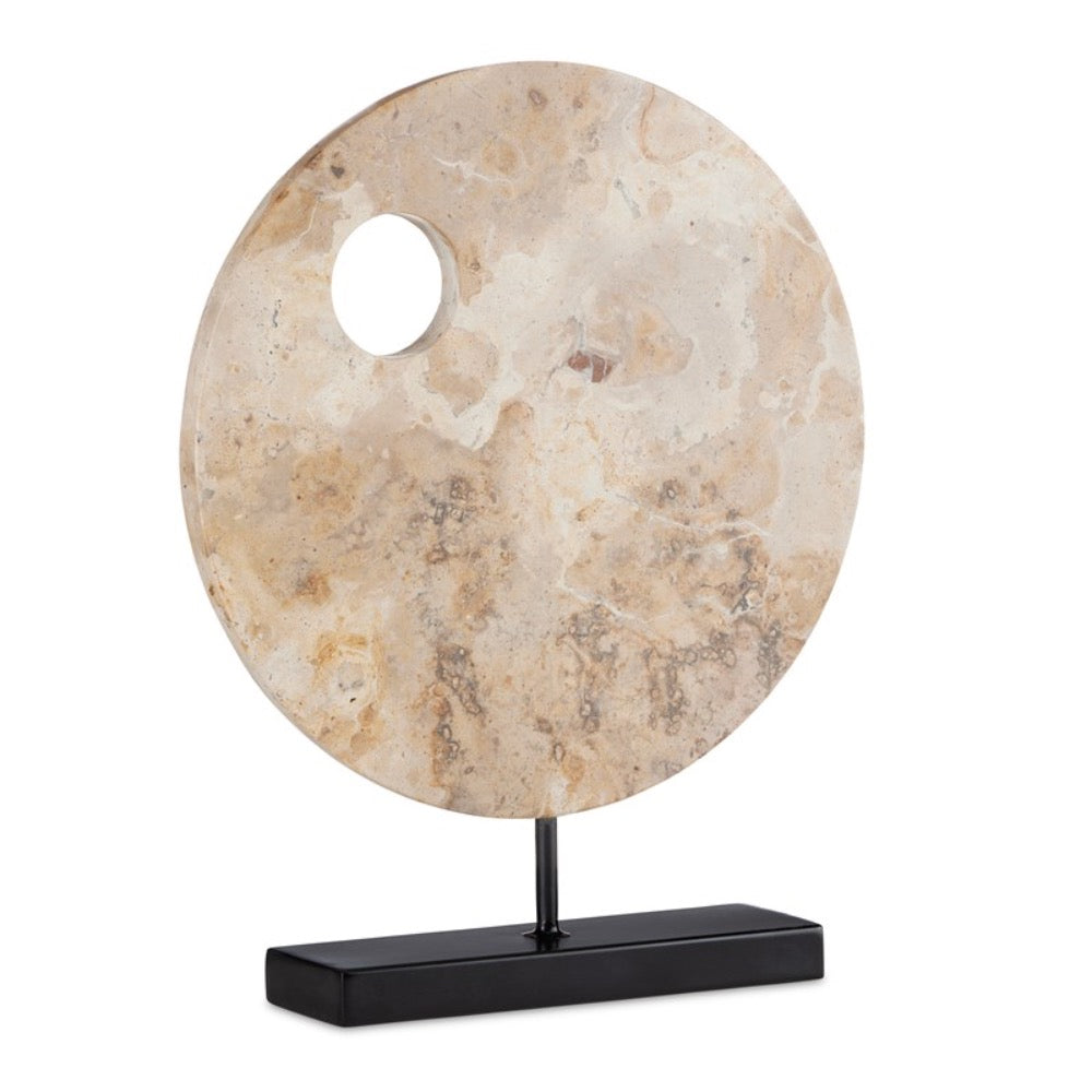 round tan marble sculpture black base