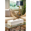 Elegant living room with a statement piece—Chelsea House's Cheetah Cream Decorative Box showcasing an antique gilded cheetah—resting on the glass coffee table, near beige chairs.