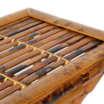 A neatly folded set of Tortoise Shell Bamboo Tray Tables with a rustic design