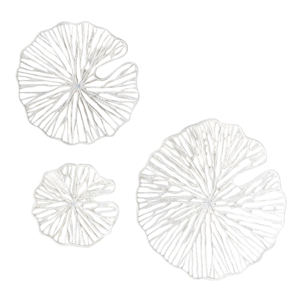 Three intricately designed white metal wall sculptures resembling abstract lily pads, varying in size, against a white background from the Handmade Paper + Metal Lily Coral Wall Decor Set by Creative Co-Op.