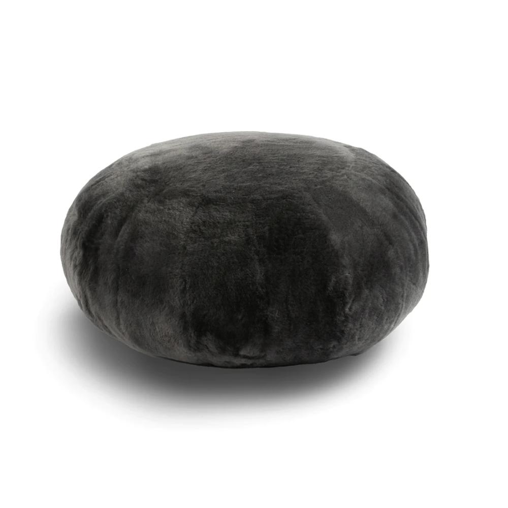 dark gray round sheepskin ottoman