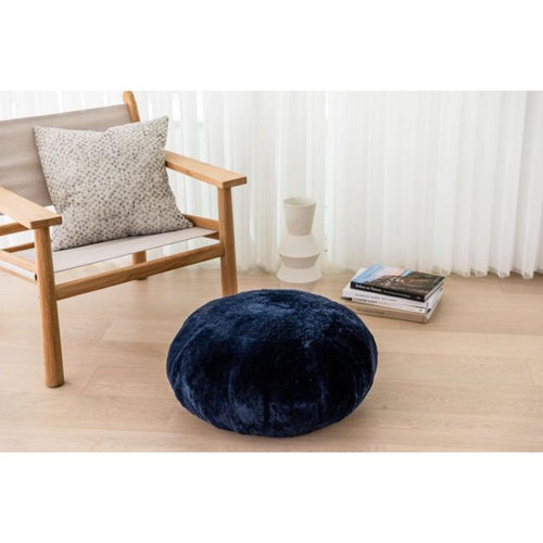 dark navy round sheepskin ottoman