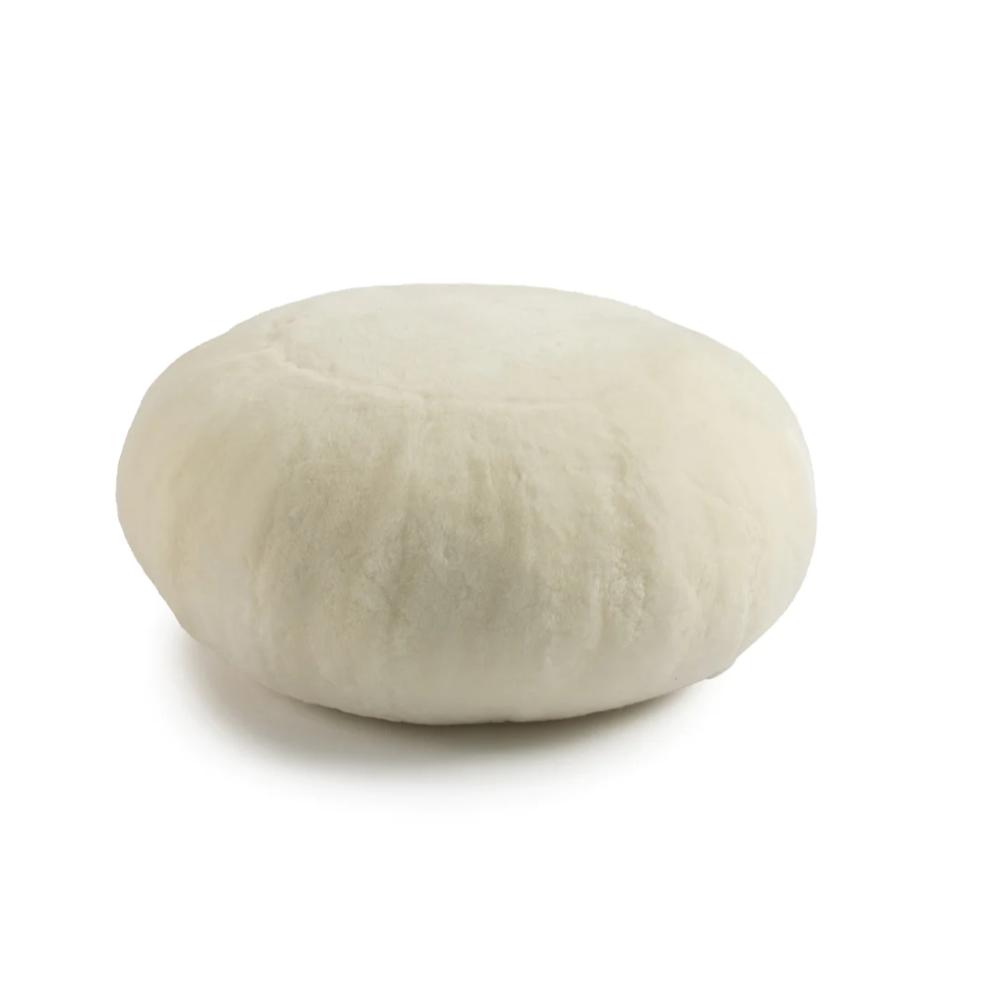 off-white round sheepskin ottoman