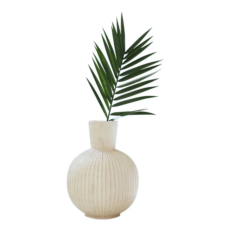 Kalalou Tall Stone Composite Fluted Bulb Vase with ridge detail and a green palm leaf on white background.