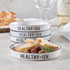 white stoneware small plates black outline words Healthy-ish