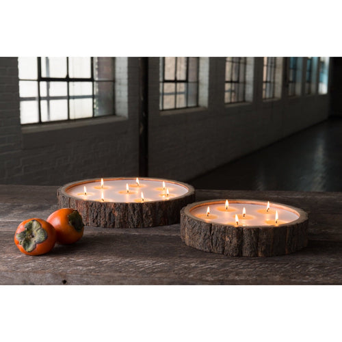 flat round brown wood candle