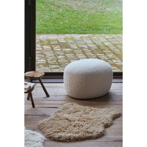 small fluffy beige pelt rug wool recycled cotton rounded edges