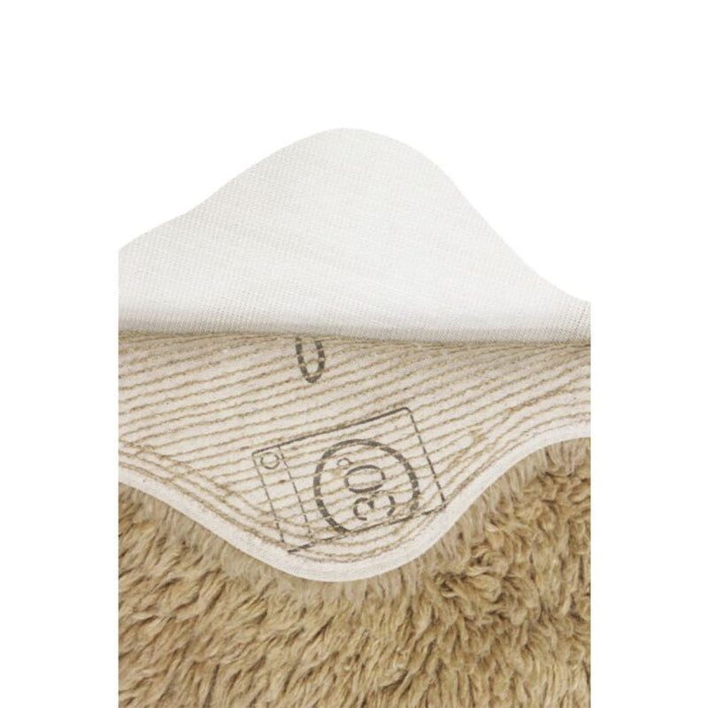 small fluffy beige pelt rug wool recycled cotton rounded edges