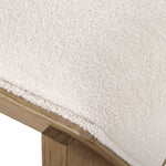 medium tone wood bench ivory sheepskin seat