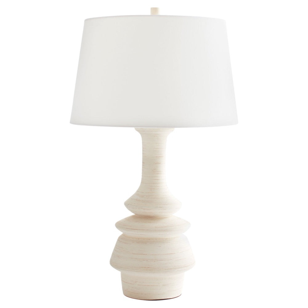 off-white striated ceramic table lamp turned silhouette white linen shade