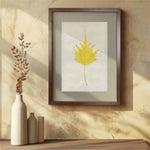 Barloga Studios' Birch Leaf Photography Art on textured beige wall, next to beige vases with dried leaves.