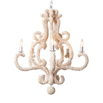 The Paula Shell Coastal Chandelier by Made Goods features rustic elegance with its spiral arms and four candle-like bulbs, accentuated by natural shell details to create a warm, classic atmosphere perfect for a coastal home.