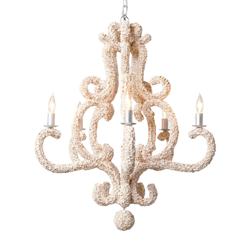 The Paula Shell Coastal Chandelier by Made Goods features rustic elegance with its spiral arms and four candle-like bulbs, accentuated by natural shell details to create a warm, classic atmosphere perfect for a coastal home.