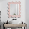 scalloped light pink-framed wall mirror organic shape waves