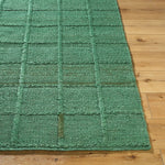 woven green jute area rug square pattern