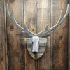 recycled wood deer head wall hung rustic on wood paneled wall