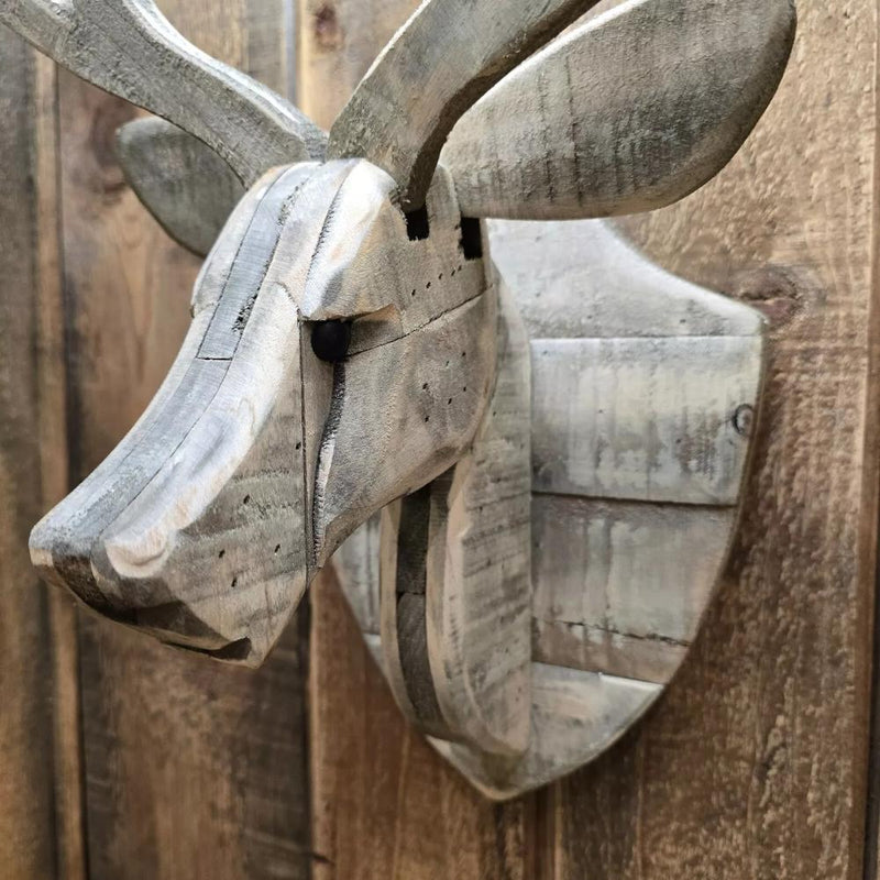 recycled wood deer head wall hung rustic on wood paneled wall showing details