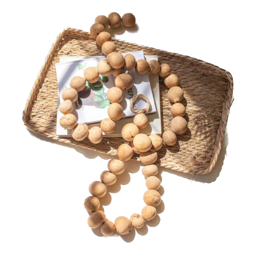 A set of Kalalou's Dried Gourd Ball Garlands, featuring woven trays crafted from natural materials and adorned with wooden beads, green stickers, and golden rings, beautifully displayed on a white background – the perfect fall decor.