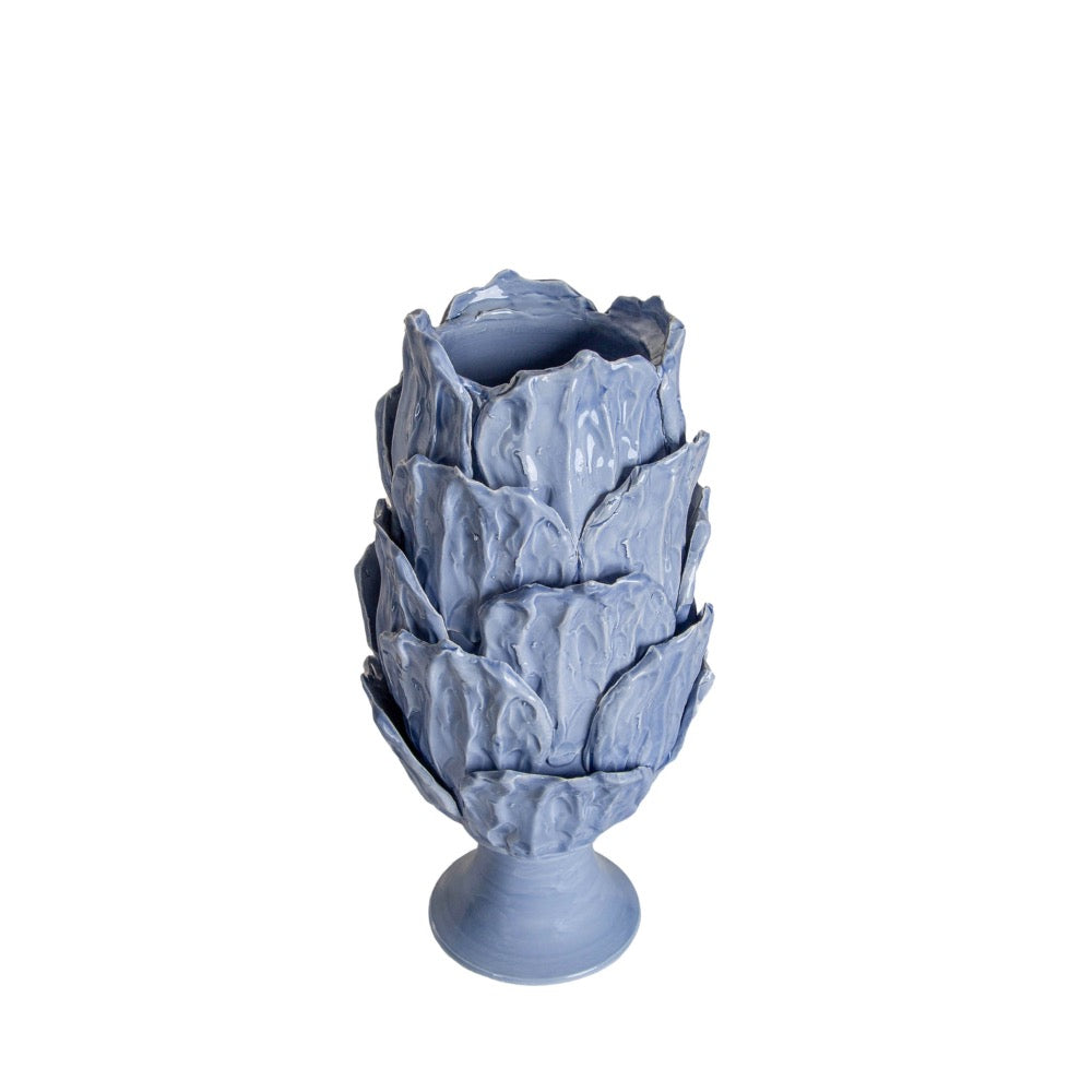 periwinkle blue vase overlapping leaves