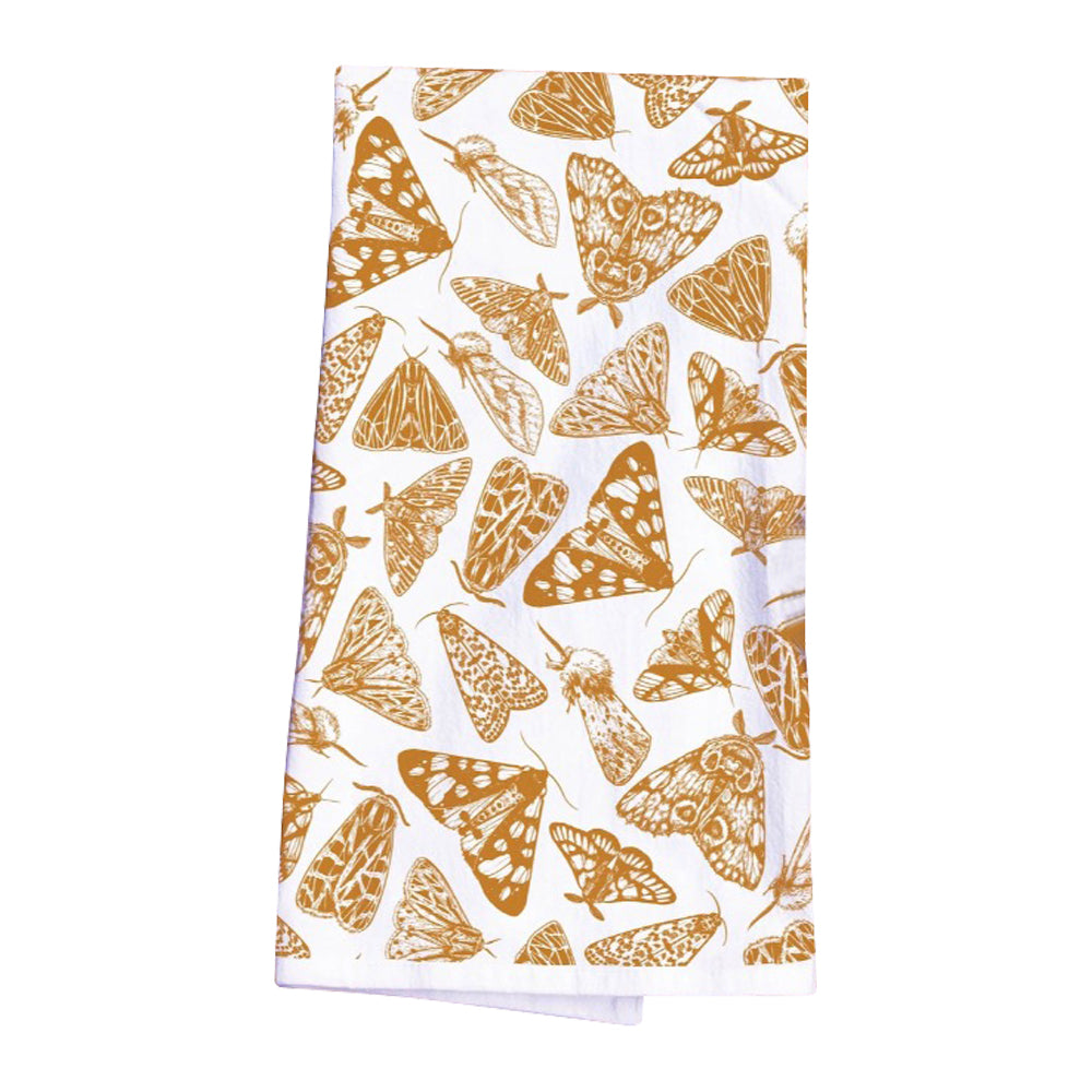 The Muse Textiles Moths Flour Sack Kitchen Towel, available in various color options, features white fabric adorned with brown moth illustrations.