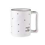 This 16oz white ceramic mug from the Holiday Merry & Bright Organic Mugs set by Santa Barbara Design Studio, featuring small black stars and "merry & bright" text, perfectly encapsulates the essence of holiday cheer.