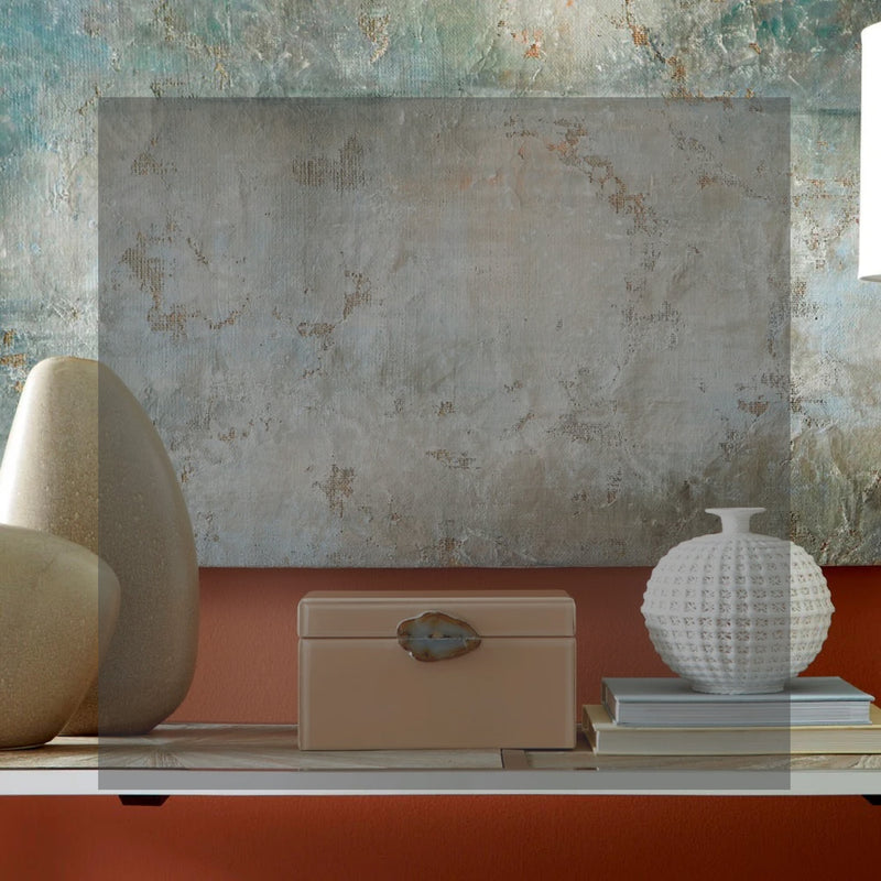 Decor items include a textured painting, abstract vases, and a decorative box on a shelf against a textured wall.