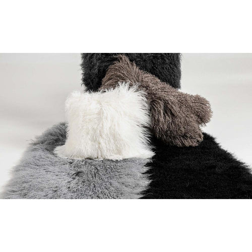 assortment of longwool pillows on sheepskin rugs