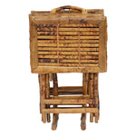 A neatly folded set of Tortoise Shell Bamboo Tray Tables with a rustic design