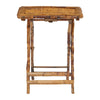 A neatly folded set of Tortoise Shell Bamboo Tray Tables with a rustic design